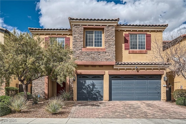 view of front of home featuring stucco siding, stone siding, an attached garage, and decorative driveway