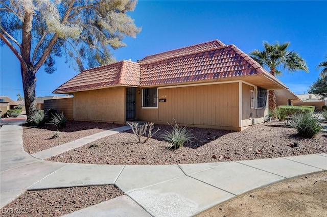 view of front of house featuring a tile roof