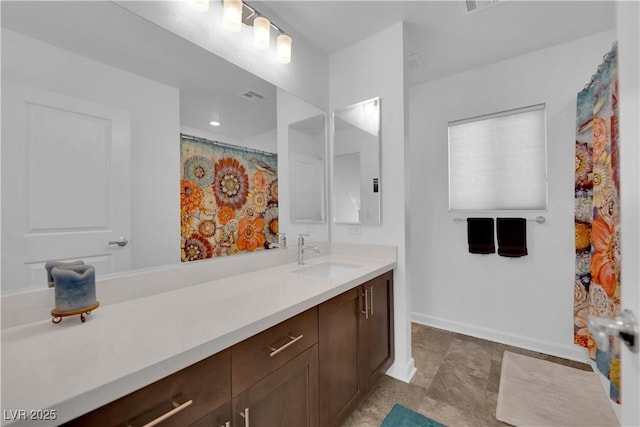 full bathroom featuring vanity and baseboards