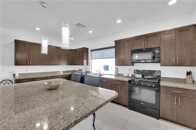 kitchen with recessed lighting, visible vents, a sink, light stone countertops, and black appliances