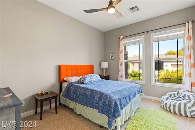 bedroom featuring baseboards, visible vents, and carpet flooring