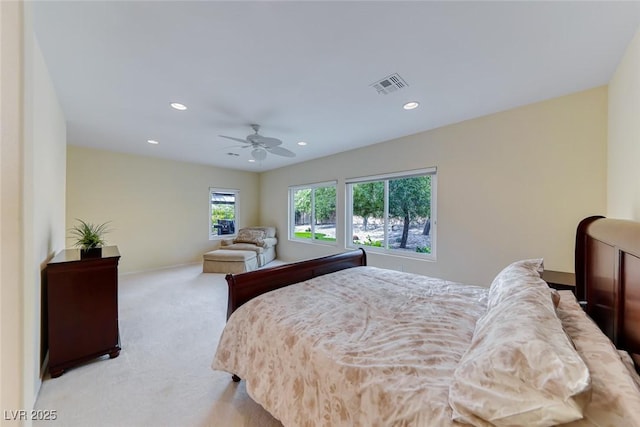 bedroom featuring recessed lighting, light colored carpet, a ceiling fan, baseboards, and visible vents