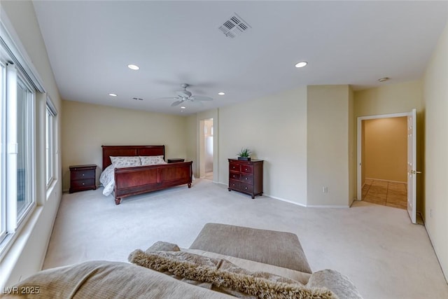 bedroom with a ceiling fan, recessed lighting, visible vents, and light colored carpet