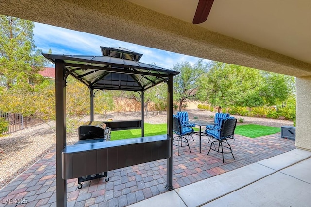 view of patio / terrace featuring a fenced backyard and a gazebo