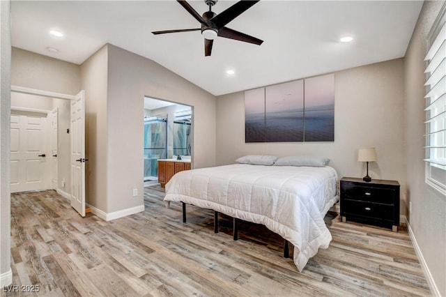 bedroom with lofted ceiling, light wood finished floors, baseboards, and recessed lighting