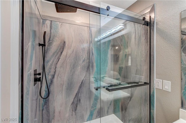 full bath with a textured wall and a marble finish shower