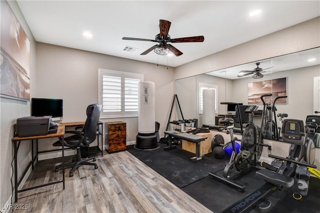 office space with baseboards, visible vents, a ceiling fan, wood finished floors, and recessed lighting