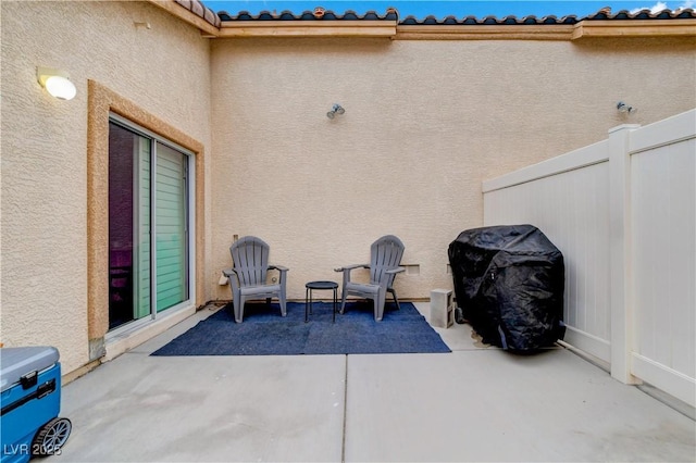 view of patio / terrace featuring fence and grilling area