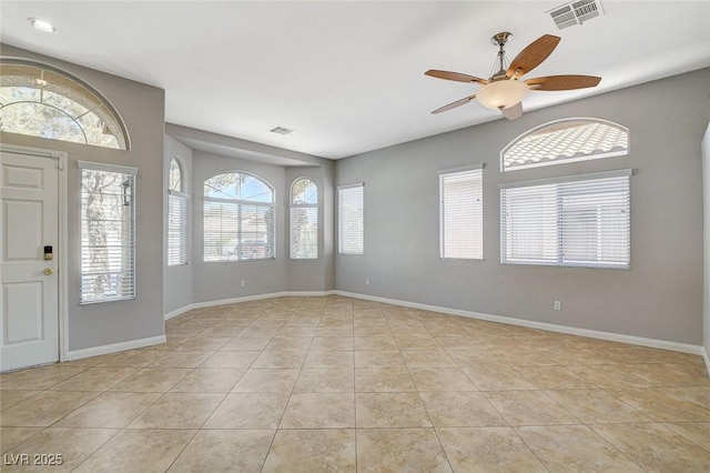 foyer entrance with tile patterned flooring, visible vents, and baseboards