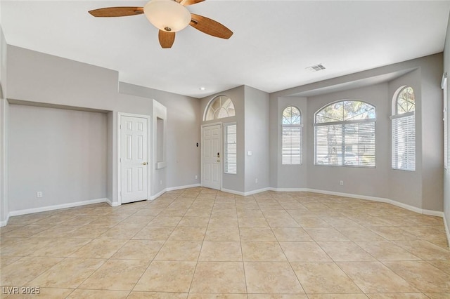 foyer entrance featuring visible vents, ceiling fan, baseboards, and light tile patterned flooring