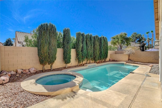 view of swimming pool featuring a fenced in pool, a fenced backyard, and an in ground hot tub