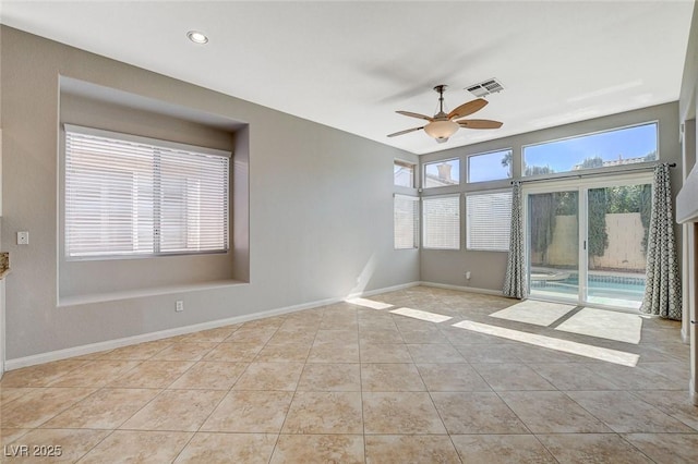 spare room featuring baseboards, visible vents, a ceiling fan, tile patterned floors, and recessed lighting