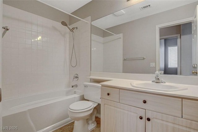 bathroom with visible vents, toilet, vanity, shower / tub combination, and tile patterned floors