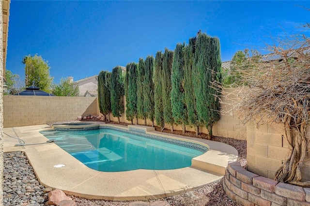 view of swimming pool featuring a fenced in pool, a fenced backyard, and an in ground hot tub