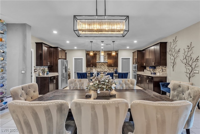 dining space with recessed lighting and light tile patterned floors