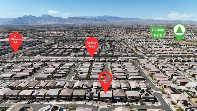 drone / aerial view featuring a residential view and a mountain view