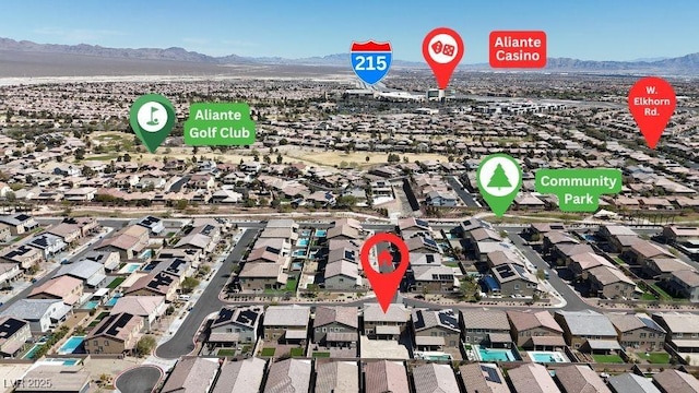 birds eye view of property with a residential view and a mountain view