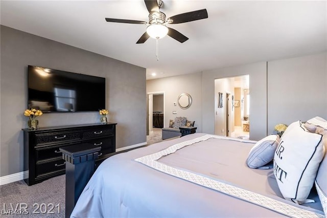 bedroom featuring carpet flooring, connected bathroom, baseboards, and ceiling fan