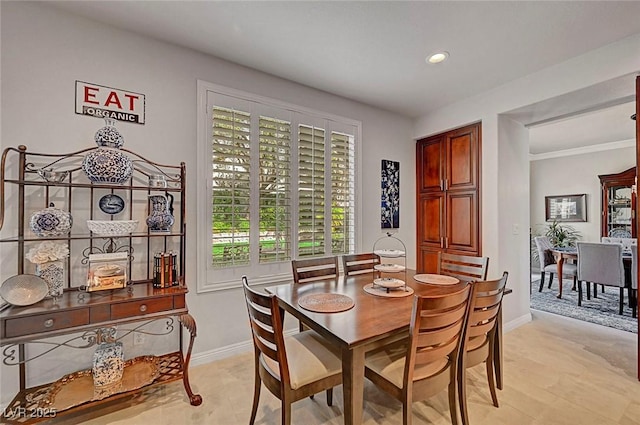 dining space with recessed lighting and baseboards