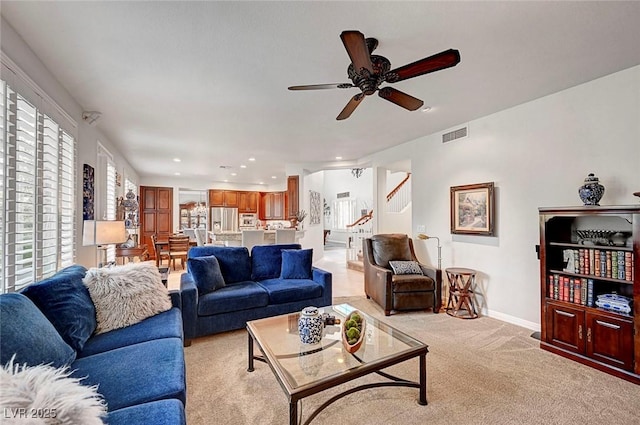 living area with recessed lighting, visible vents, a ceiling fan, light carpet, and baseboards