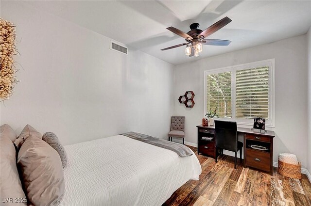 bedroom with light wood-style floors, visible vents, ceiling fan, and baseboards