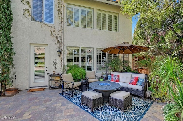 view of patio / terrace with an outdoor living space with a fire pit