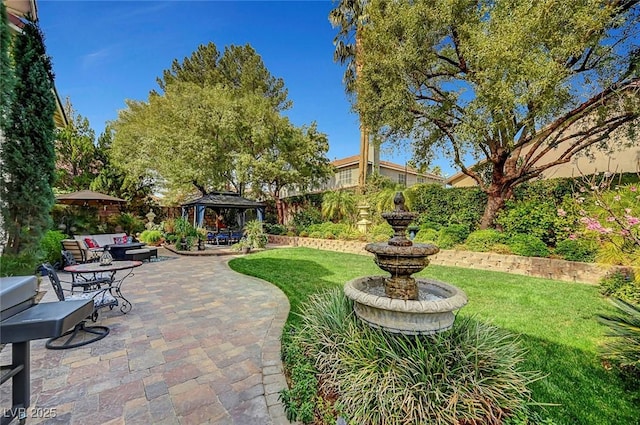 surrounding community with a gazebo, a yard, a patio, and fence