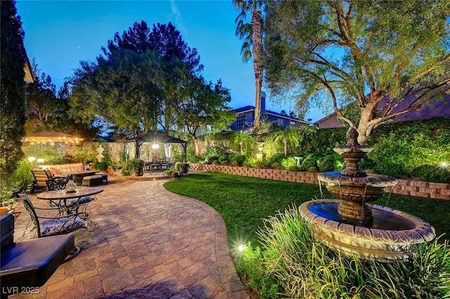 view of yard featuring a patio area, an outdoor living space, and a gazebo