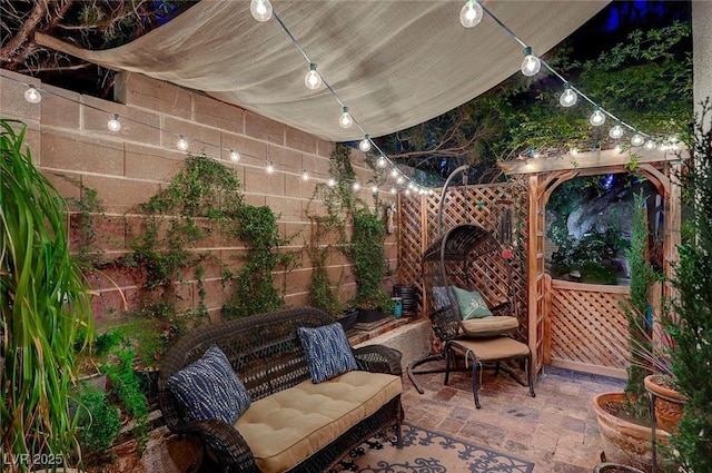 view of patio with fence and an outdoor hangout area