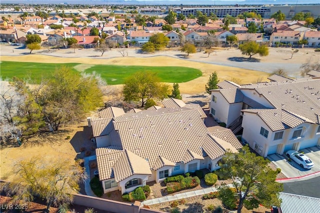 bird's eye view with view of golf course and a residential view