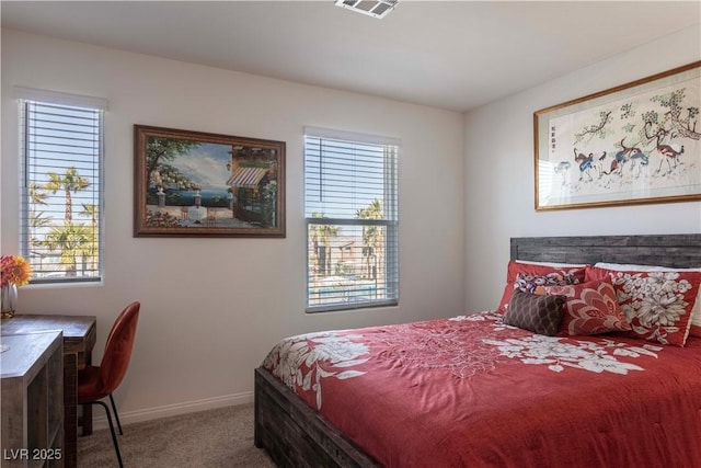 carpeted bedroom with baseboards