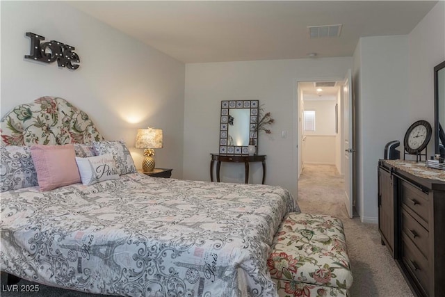 bedroom featuring light carpet and visible vents