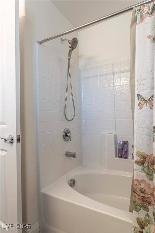 bathroom featuring shower / tub combo with curtain