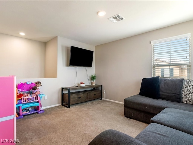 carpeted living room with recessed lighting, visible vents, and baseboards