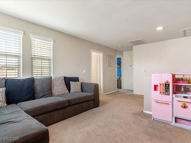 living area featuring light carpet, baseboards, visible vents, and recessed lighting