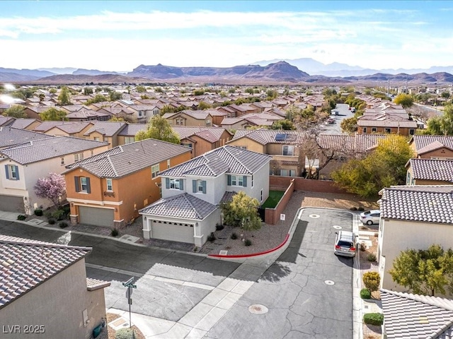 aerial view with a mountain view and a residential view