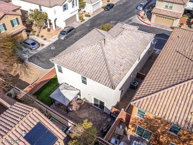 birds eye view of property with a residential view