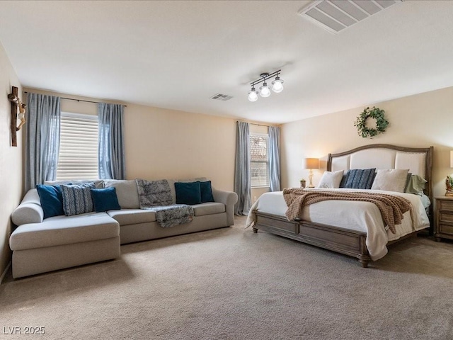 bedroom featuring visible vents and carpet flooring