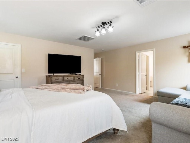 bedroom with carpet floors, visible vents, and baseboards