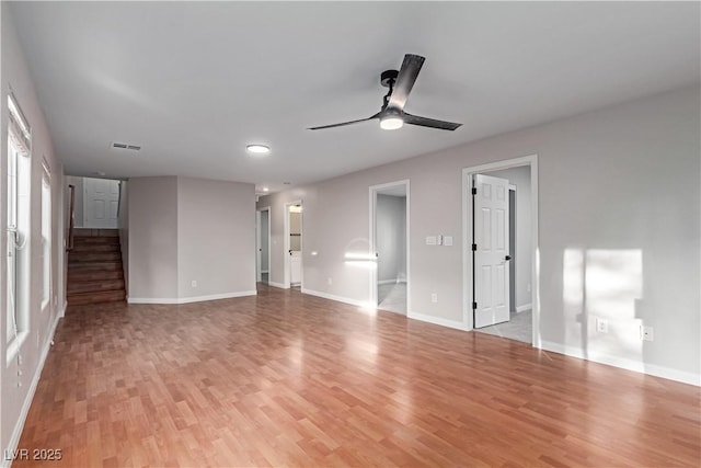 interior space featuring light wood finished floors, visible vents, and baseboards