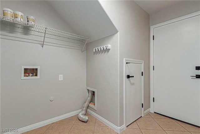 washroom with laundry area, baseboards, light tile patterned floors, and washer hookup