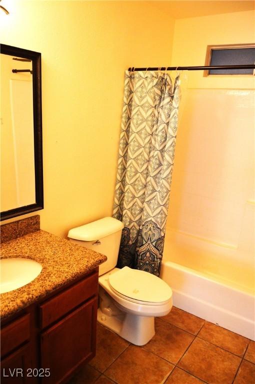 full bathroom with toilet, tile patterned flooring, shower / bathtub combination with curtain, and vanity