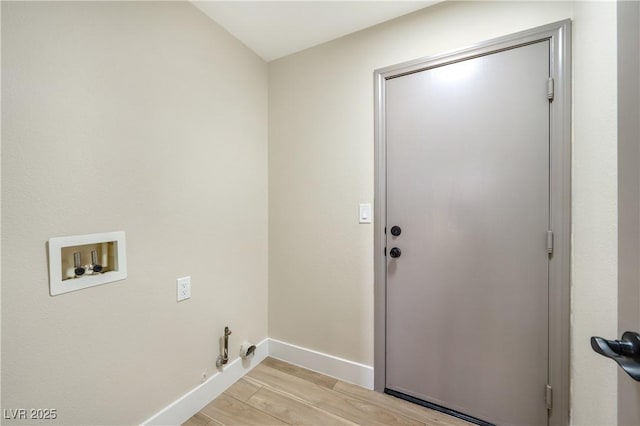 laundry room with laundry area, baseboards, washer hookup, and light wood finished floors