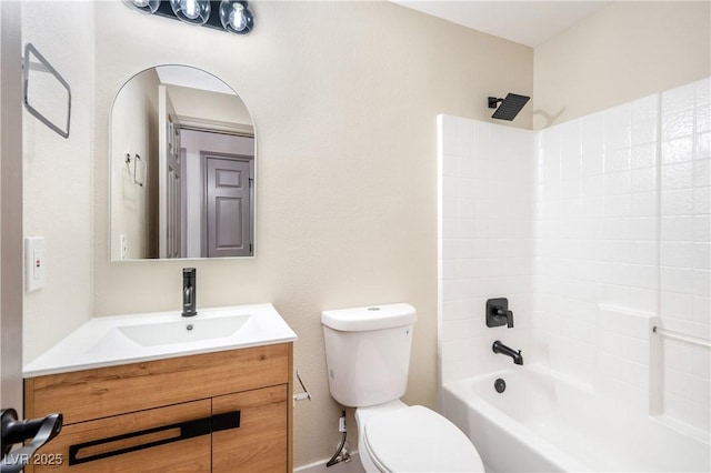 bathroom with shower / washtub combination, vanity, and toilet