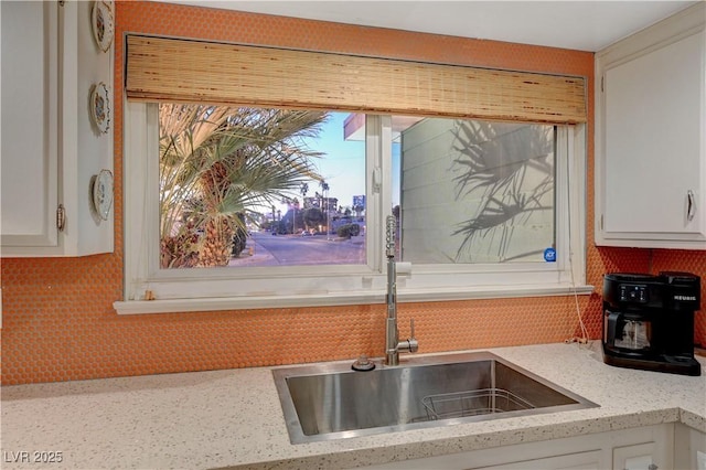 kitchen featuring white cabinets