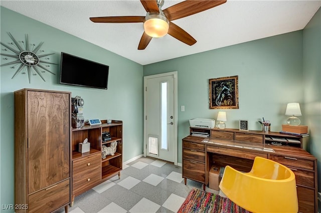 home office with ceiling fan, light floors, and baseboards