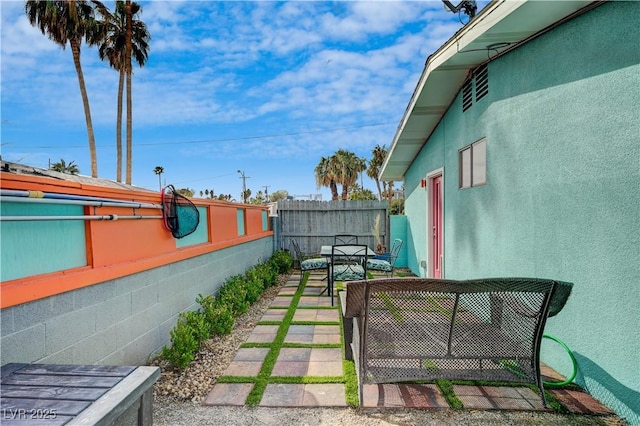 view of yard with a patio area and fence