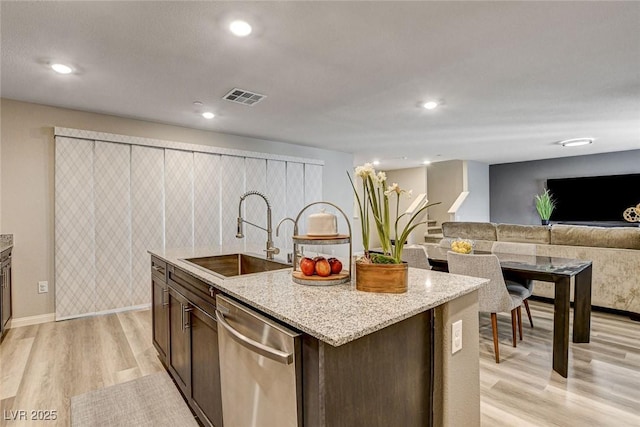 kitchen featuring recessed lighting, a sink, visible vents, dishwasher, and light wood finished floors