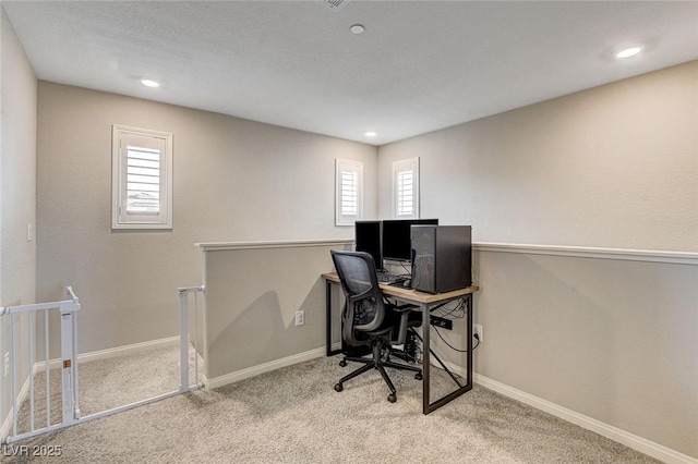 carpeted office featuring recessed lighting and baseboards