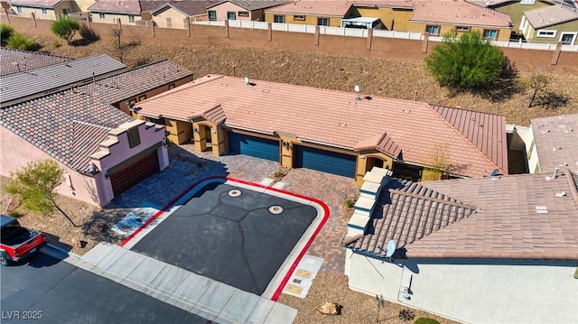 birds eye view of property with a residential view